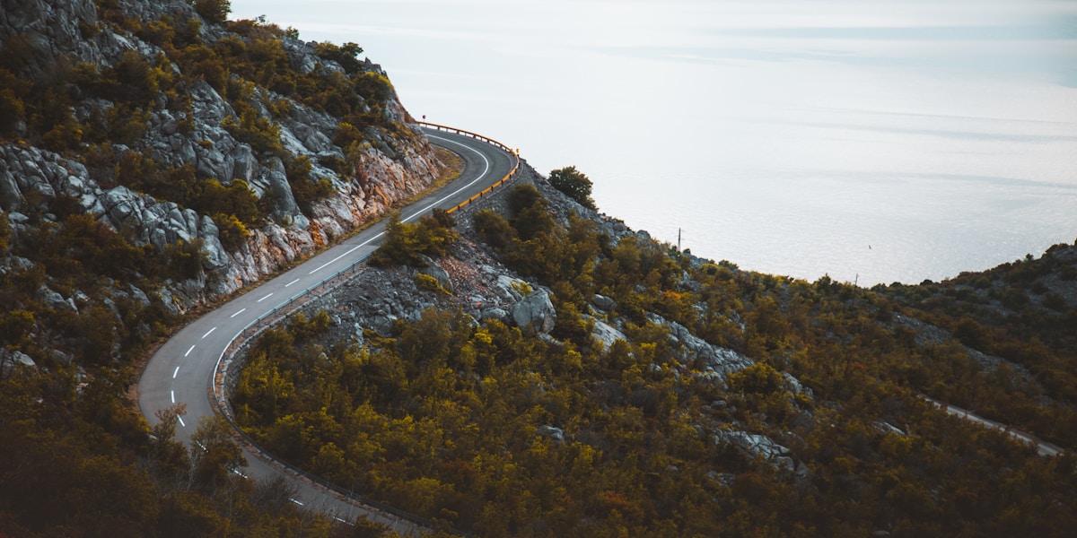 Winding mountain road through scenic landscape